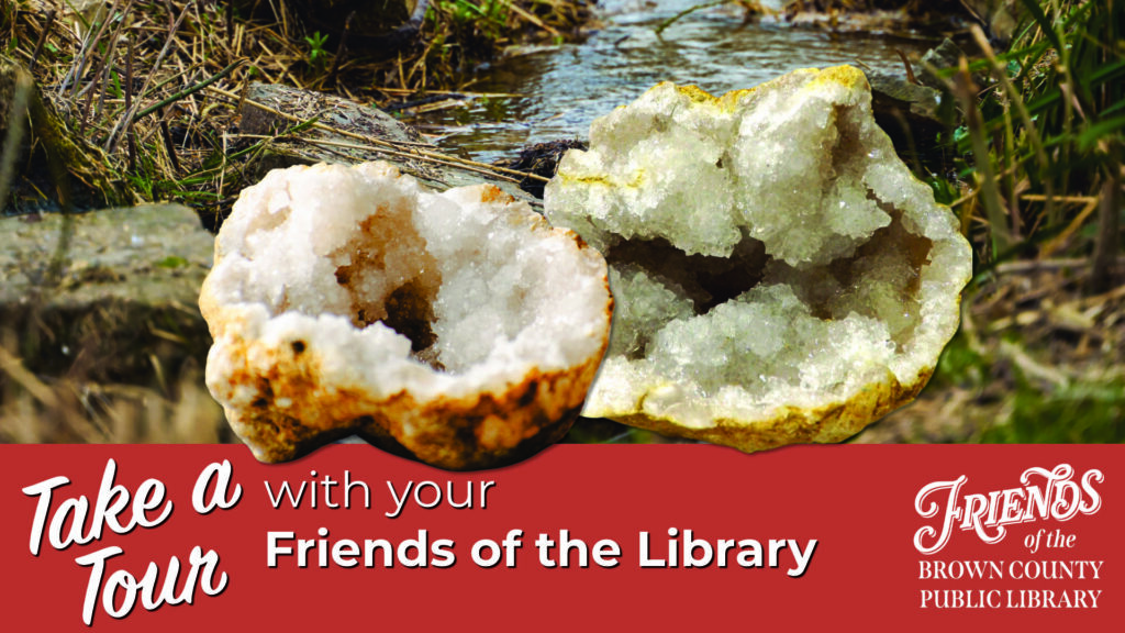 Two geodes in front of a stream